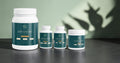 GLP Nutrition Source Daily Essentials system featuring protein, probiotic, multivitamin, and hydration powder bottles.